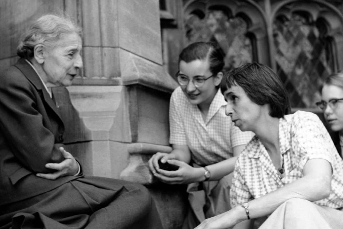 Chemist Lise Meitner with students (Sue Jones Swisher, Rosalie Hoyt and Danna Pearson McDonough) on the steps of the chemistry building at Bryn Mawr College. Courtesy of Bryn Mawr College. (April 1959)